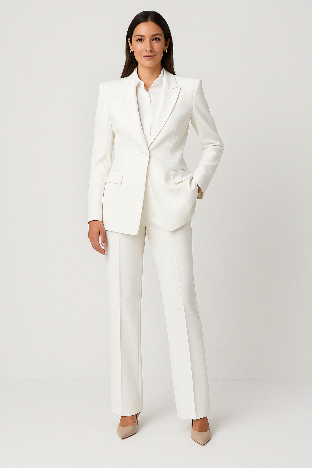 "Full-body photo of a woman in a structured white power suit from House of Roy, styled for professional women in leadership roles"